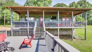 A two-story wooden cabin with a covered porch, a fire pit, and outdoor seating. - Hiawassee Cabin Near Lake Chatuge + AT Trailheads (Hiawassee)