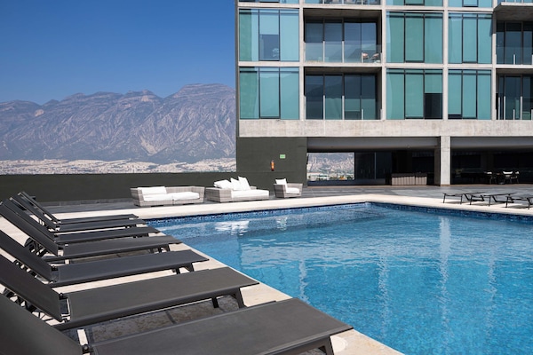 Take a refreshing dip in the pool or lounge under the sun with stunning views all around.