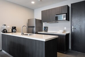 Fridge, microwave, stovetop, coffee/tea maker