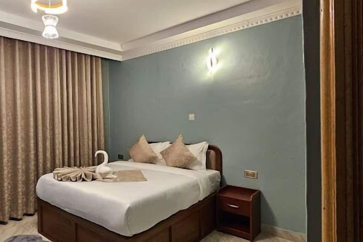 Habitación individual Deluxe, vista al jardín | Wifi gratis y ropa de cama