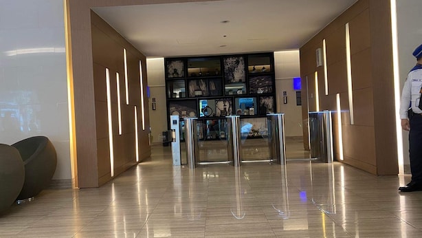 A modern hotel lobby with a sleek design, featuring a reception desk, a wall with framed artwork, and a clean, polished floor. - Green Residences Taft Ave. by darpm (Manila)