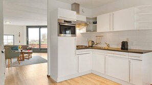 Fridge, stovetop, dishwasher, coffee/tea maker