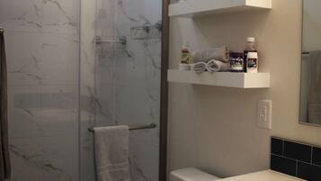 Shower, hair dryer, towels, soap