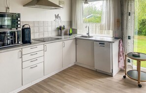 Fridge, stovetop, dishwasher, coffee/tea maker