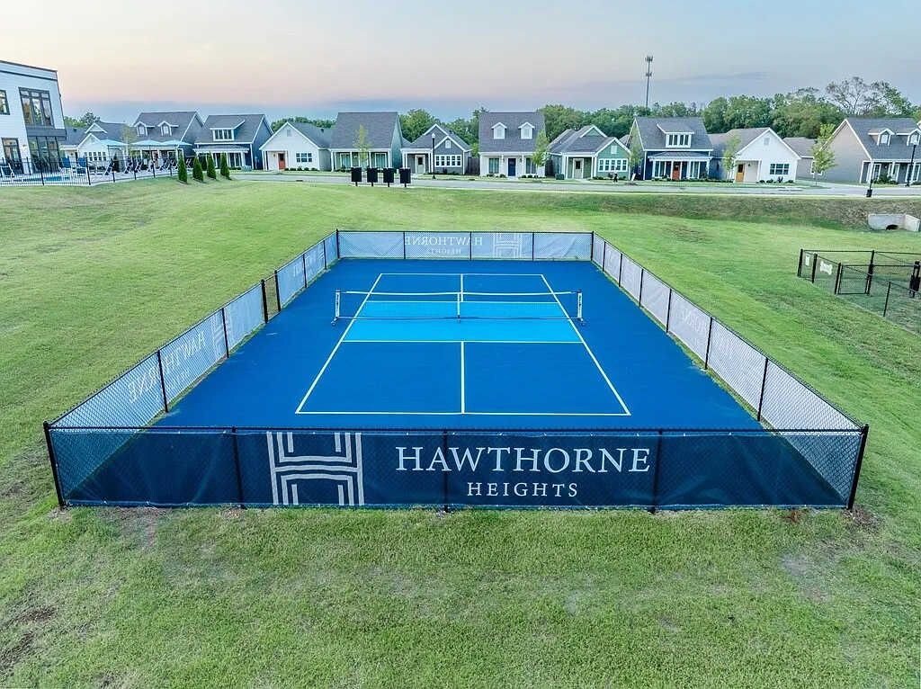 A tennis court with a net, surrounded by a fence, and labeled "HAWTHORNE HEIGHTS".