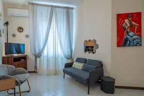 Apartment | Living area | 32-inch flat-screen TV with cable channels