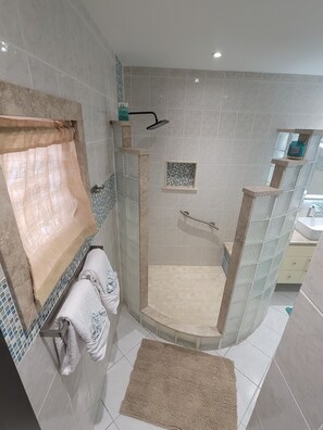 Shower, hair dryer, towels, toilet paper