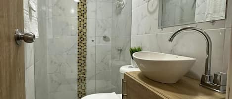 Shower, towels, soap, toilet paper