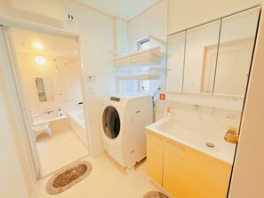 Hair dryer, bidet, towels, soap