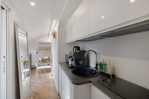 Fridge, microwave, stovetop, coffee/tea maker