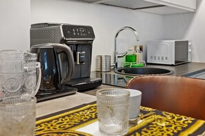 Fridge, microwave, stovetop, coffee/tea maker