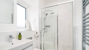 Shower, hair dryer, towels
