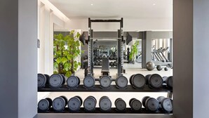 A modern gym with weightlifting equipment, including dumbbells and a squat rack. - For Students Only - Studios in Oxford (Oxford)