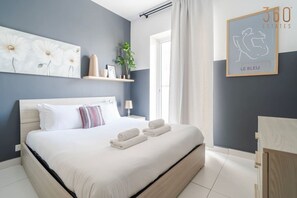 1 bedroom, desk, iron/ironing board, travel crib