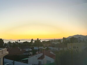 A residential area with houses, a body of water, and a mountain in the background. - Bright 'Luminoso Marbella' Apartment with Sea Views, Wi-Fi and Air Conditioning (Marbella)