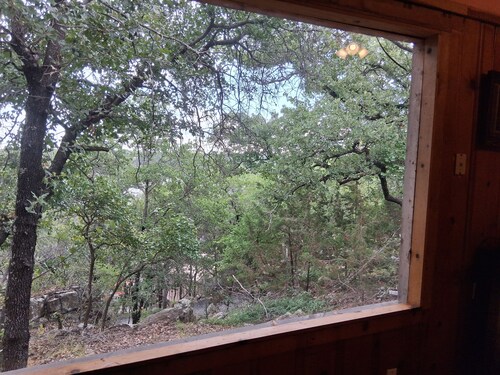 Serene lake front cabin set on bluff overlooking Palo Pinto lake.