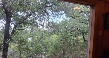 Serene lake front cabin set on bluff overlooking Palo Pinto lake.