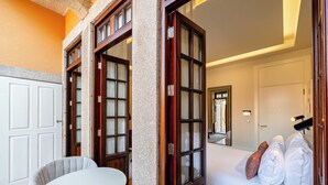 A hotel room with a bed, a table, and a chair. - YOUROPO - Collection (Porto)