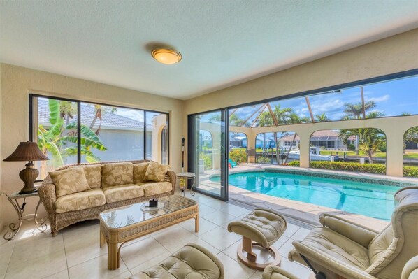 House, Multiple Beds, Pool Access, Pool View (VIV2141) | Living area | Fireplace - 2141 Via Venice (Punta Gorda)