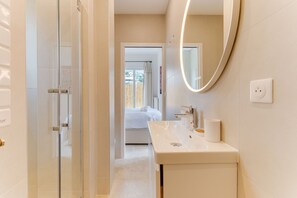 Shower, hair dryer, towels, toilet paper