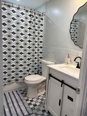 Hair dryer, towels, soap, toilet paper