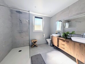 Shower, hair dryer, towels, toilet paper