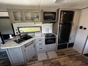 Private kitchen - Huge RV w/ 4 bed Bunkhouse close to the beach! (Crystal Beach)