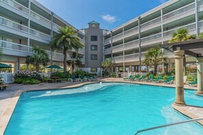 Outdoor pool, a heated pool - Oceanview Condo w/ Wifi, SmartTVs, Foosball, Pools & Balcony – Walk to Beach! (Galveston)
