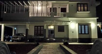 Spacious 4-bedroom house with WiFi, AC in serene Kannur
