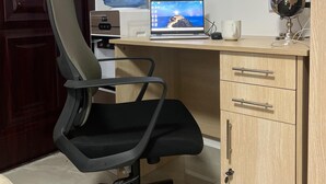 A small office space with a desk, chair, and a water cooler. - Luxe Nairobi Escape, Walk to Swahili Eats & Mall & 15 minutes drive to Park. (Nairobi)