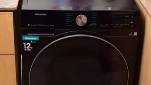 A Hisense washing machine with a 12kg capacity, placed on a kitchen counter. - Luxe Nairobi Escape, Walk to Swahili Eats & Mall & 15 minutes drive to Park. (Nairobi)