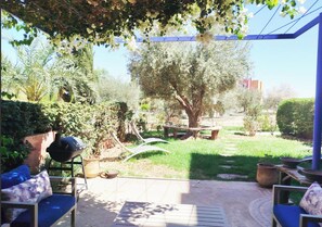 Familie appartement, uitzicht op tuin | Terras