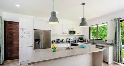 Casa Tuga is a bright 4BR, 4BA home with a private pool (with kid-friendly area), Just a short walk to the beach and restaurants.