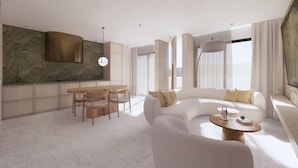 Un salon moderne doté d’un grand canapé en forme de L, d’un coin repas avec une table et des chaises en bois, et d’une cuisine avec un pare-feu en pierre.