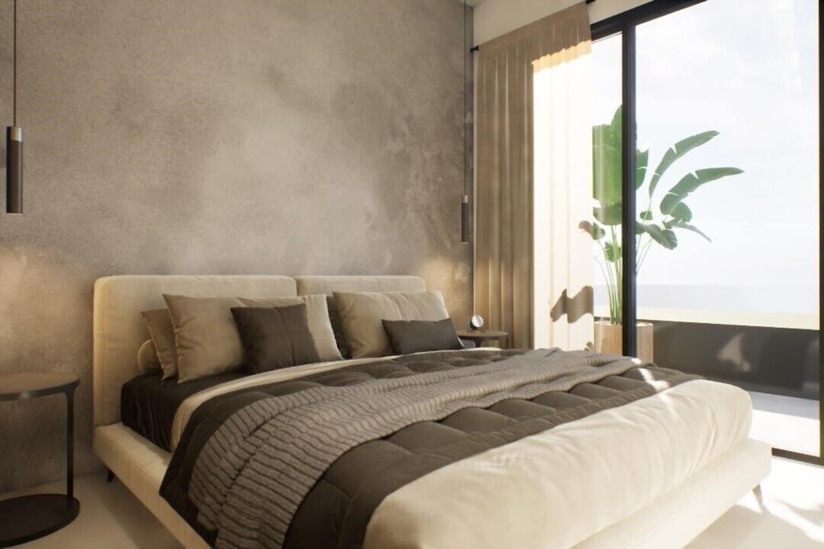 Un dormitorio moderno con una cama grande, una mesita de noche y un ventanal con vistas.