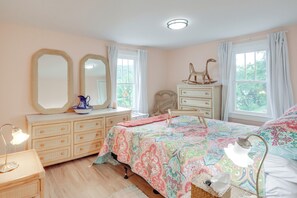 A bedroom with a bed, dresser, and two mirrors. - River Views & Boat Launch Access: Huntingdon Home (Huntingdon)