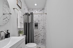 Shower, hair dryer, towels, soap