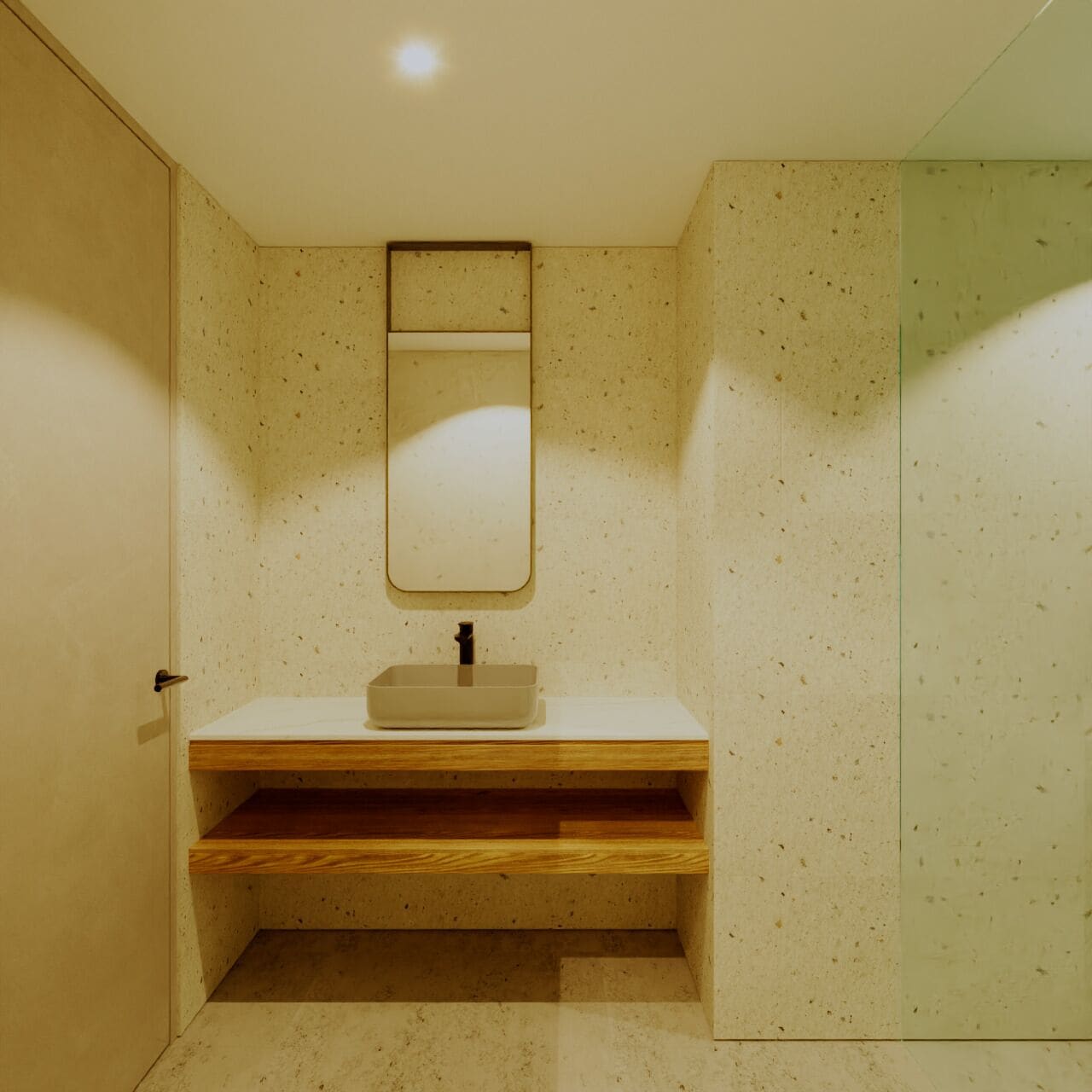 A bathroom with a wooden vanity, a mirror, and a tiled wall.