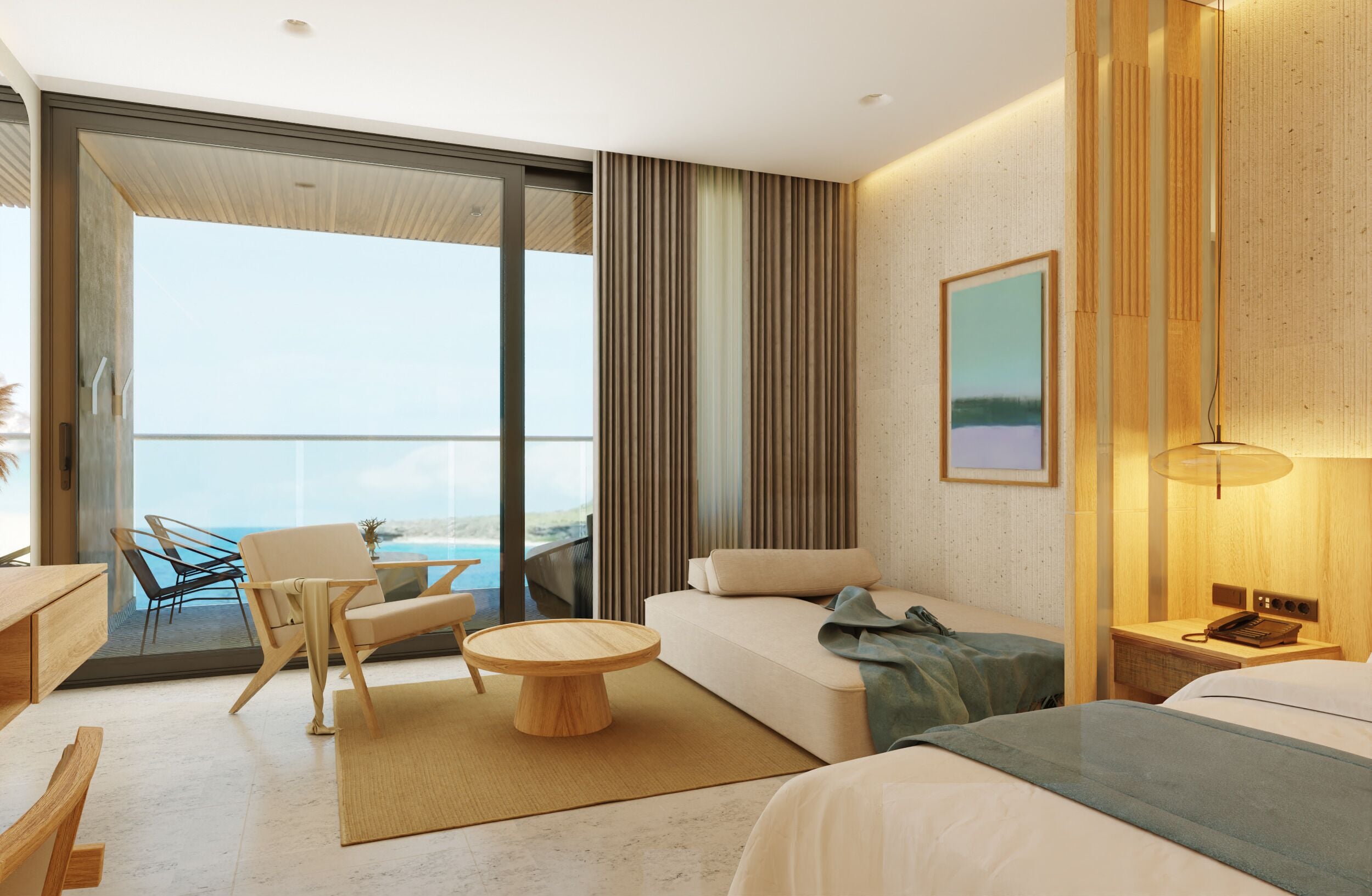 A modern hotel room with a large balcony, a sofa, a round wooden coffee table, and a bed with a blue blanket.
