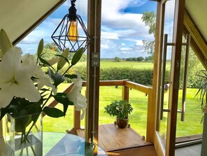 A wooden deck with a view of a green field and a clear sky. - The View, Countryside Retreat with private hot tub, Cheshire (Nantwich)