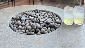 An outdoor seating area with a fire pit, benches, and two glasses of a beverage. - Luna Ridge Chalet + Hot Tub + Mins to Bear Mtn (Big Bear Lake)
