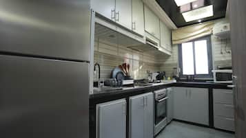 Luxury Apartment, Patio, Garden View | Private kitchen | Full-sized fridge, microwave, oven, stovetop
