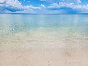 A beach with clear shallow water and a sandy shore. - Coco Cobana - Heated Pool Home Near Vanderbilt Beach & Mercato - Sleeps 8 (Naples)