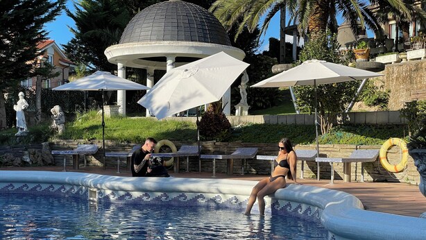 A pool area with a gazebo, lounge chairs, and a photographer. - Ebony & Ivory Suite Home. Probably One of a Kind in Spain (Camargo)