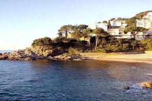 A coastal hotel with multiple buildings, a rocky shoreline, and a beach. - 🏖Sea views + private beach. What else? (Tossa de Mar)