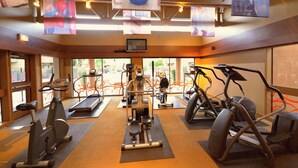 A gym with treadmills, elliptical machines, and a weight machine. - Golf Course remodeled main floor condo in Old Town Scottsdale with King beds (Scottsdale)