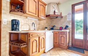 Fridge, stovetop, dishwasher, coffee/tea maker