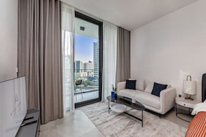 Classic Apartment, Balcony, Pool View | Living area | 50-inch Smart TV with digital channels