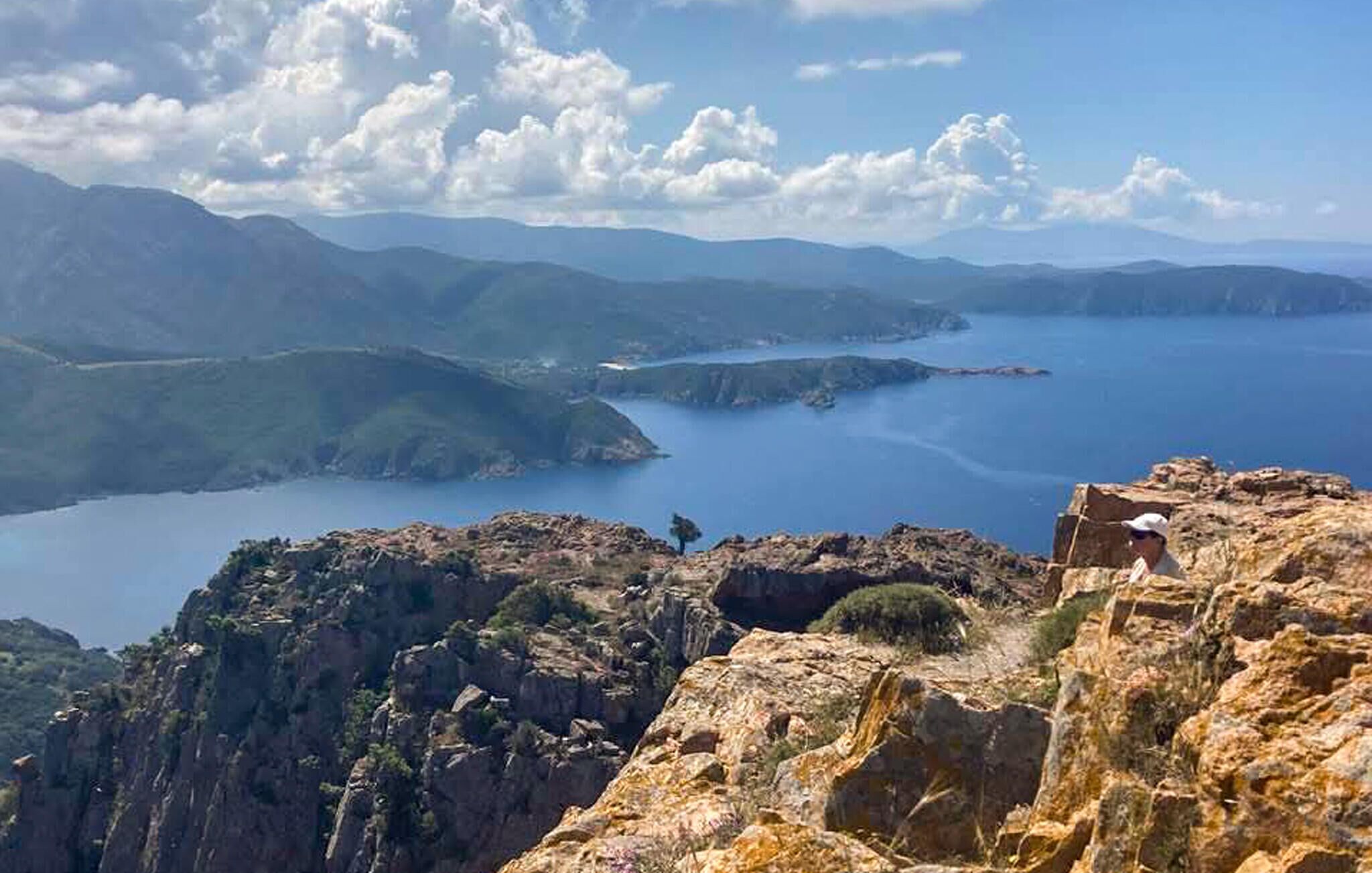 A coastal landscape with rugged cliffs and a body of water.