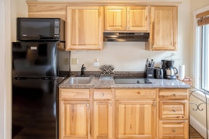 Studio, 1 King Bed, Balcony | Private kitchen | Microwave, coffee/tea maker